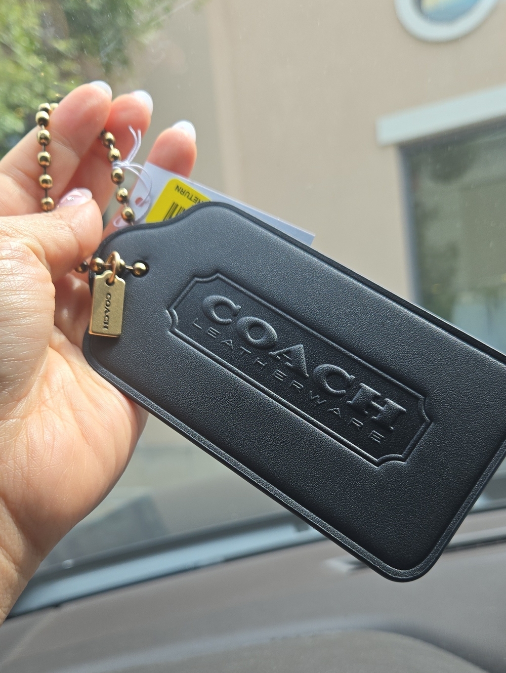 Coach Black Oversized Tag with Gold Ball Chain